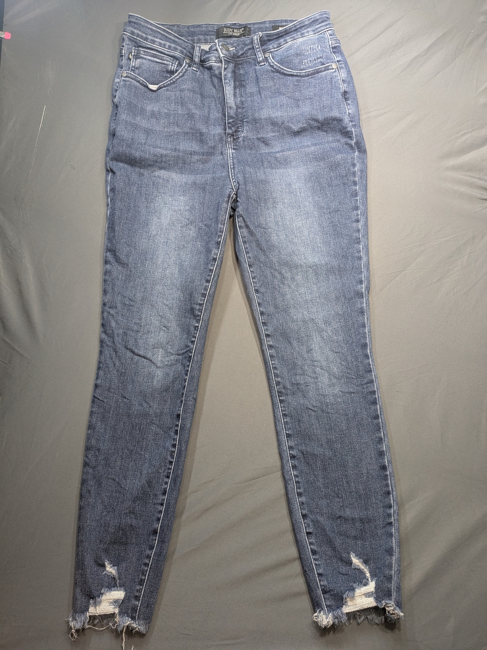 Judy Blue Light-Mid Blue High-Rise Skinny Jeans with Distressed Hem